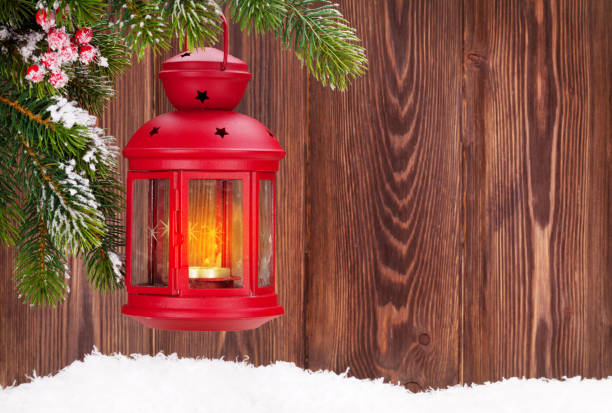 istock Christmas candle lantern on fir tree branch 874769332
