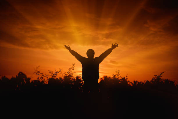istock Men raise their arms up the sky 874769498