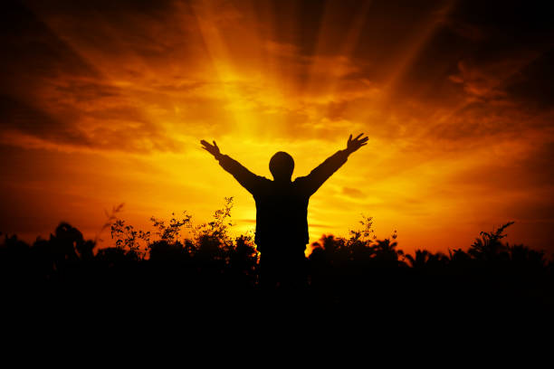 istock Men raise their arms up the sky 874769524