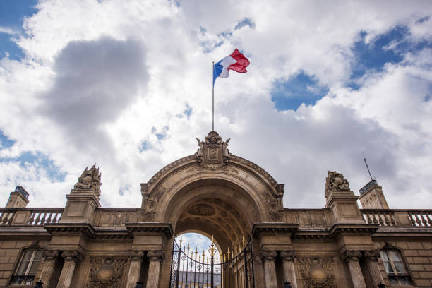 Flag of France at entrance gate of Elysée Palace, Paris, France Paris, France - September 10, 2017: The flag of France blow at the main entrance gate of Elysée Palace. europa mythological character stock pictures, royalty-free photos & images