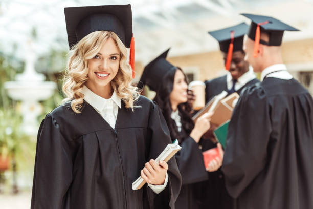 istock student girl in graduation costume 874775606