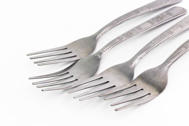 istock The silver stainless steel of forks on white background 874776356