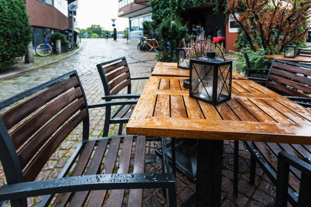 istock empty wooden wet table in outdoor cafe 874778570