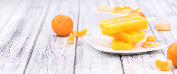 istock Homemade Tangerine Popsicles (close-up shot) 874779318