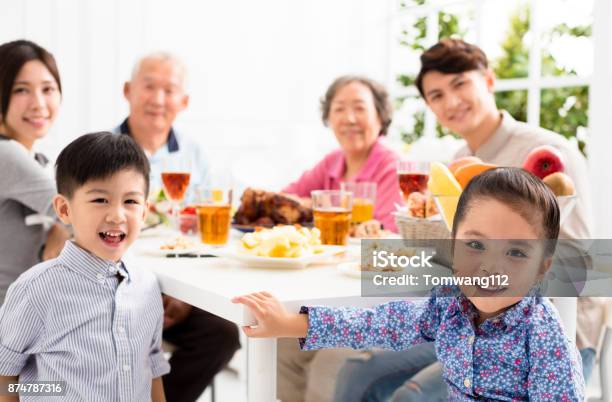 Happy Asian Family Having Dinner at Home Stock Photo - Download Image Now - Family, Restaurant, Eating