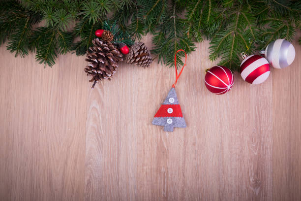 istock Christmas ornaments with pine tree and cones 874791594