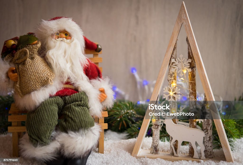 Christmas ornaments with snow, pine tree, Santa Claus and xmas lights Advent Stock Photo