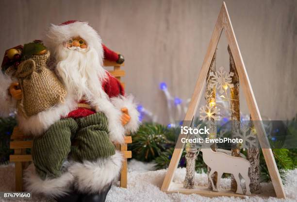 Christmas Ornaments With Snow Pine Tree Santa Claus And Xmas Lights Stock Photo - Download Image Now