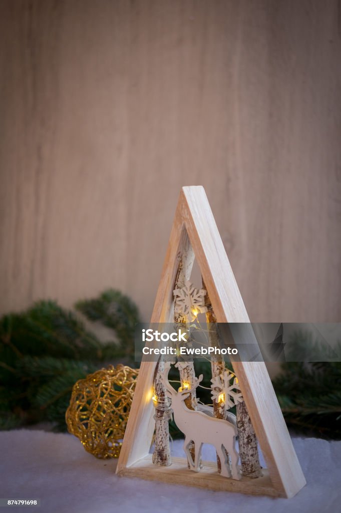 Christmas ornaments and xmas lights with snow, pine tree and cone Advent Stock Photo