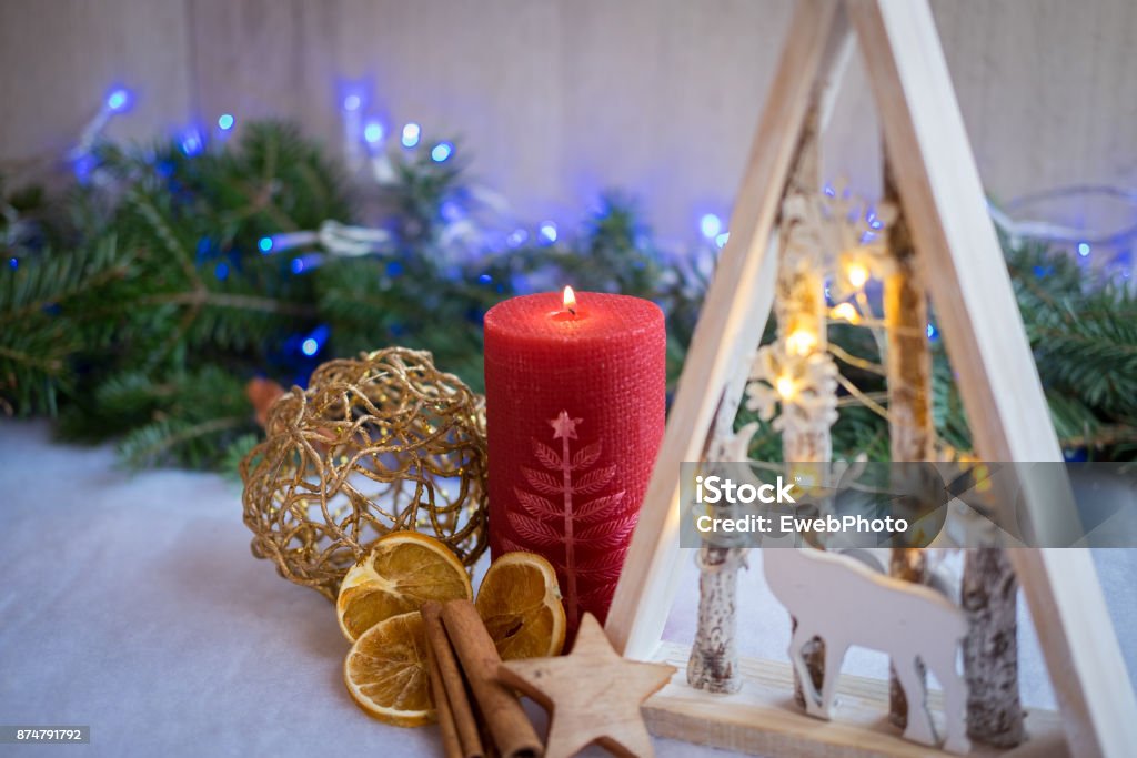 Christmas ornaments and xmas lights with snow, pine tree and candles Advent Stock Photo