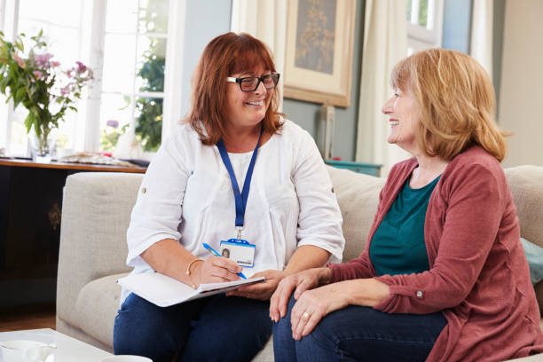 istock Female Support Worker Visits Senior Woman At Home 874793774