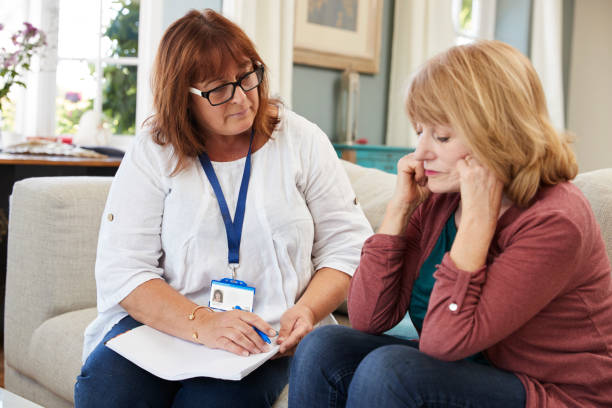 istock Support Worker Visits Senior Woman Suffering With Depression 874793778