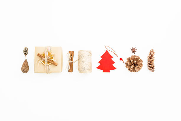 istock Holiday composition. Gift box, Christmas decoration, cinnamon and pine cones on white. Flat lay, top view 874794102