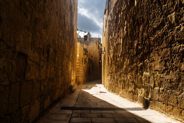 istock Old Narrow Road in Mdina 874794726