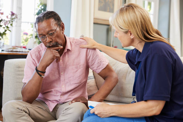 support worker visits senior man suffering with depression - mental health depression illness healthy lifestyle imagens e fotografias de stock