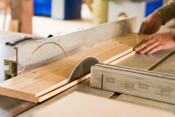 istock Circular saw cuts wood close up 874800664