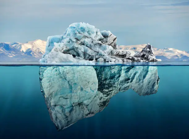 iceberg with above and underwater view taken in greenland