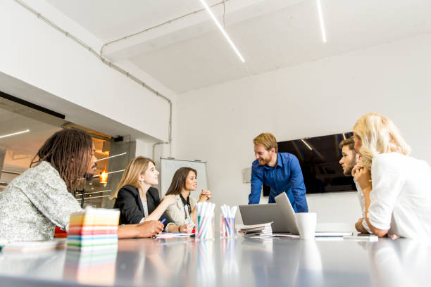 istock Business people discussing a strategy and working together in office 874809620