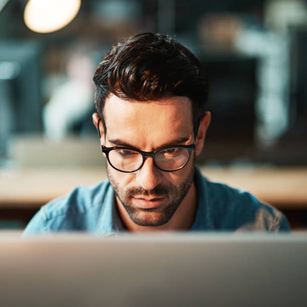 istock Focused in the face of business 874811566
