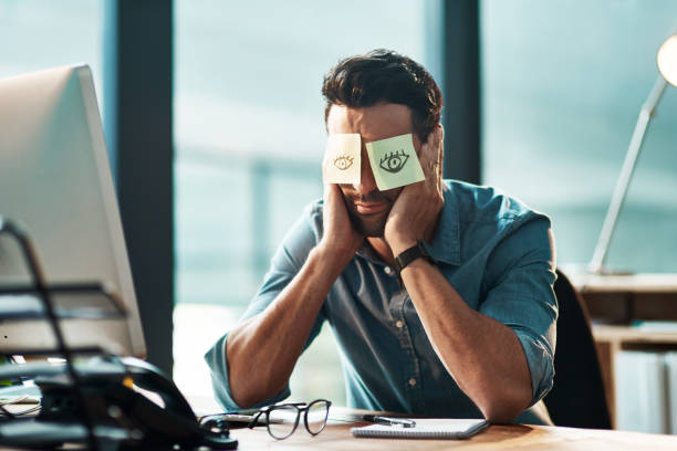 That's it, I'm done Shot of a tired young businessman working at his desk with adhesive notes covering his eyes trouble sleeping stock pictures, royalty-free photos & images