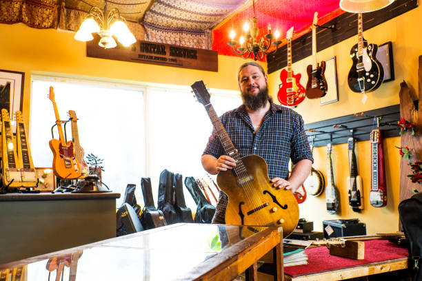 Luthier in his guitar repair shop