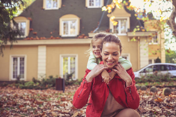istock Mother spending time with daughter. Autumn season. 874815284