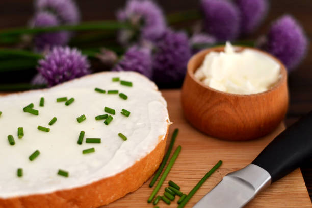 Cottage cheese and chives on the bread slice