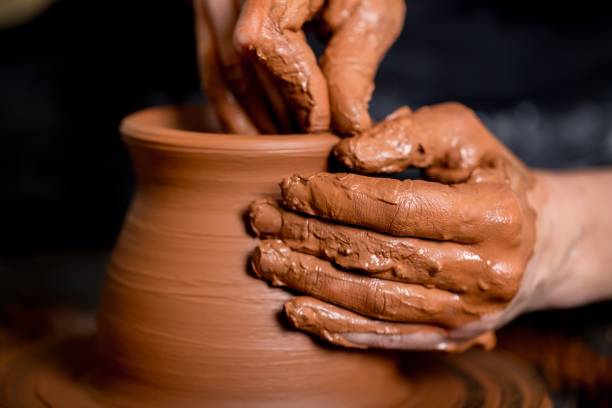 Craft. Hands of potter making clay pot, closeup photo clay stock pictures, royalty-free photos & images