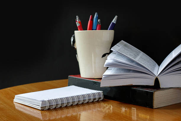 istock Education concept,book and pen on wood table 874829644
