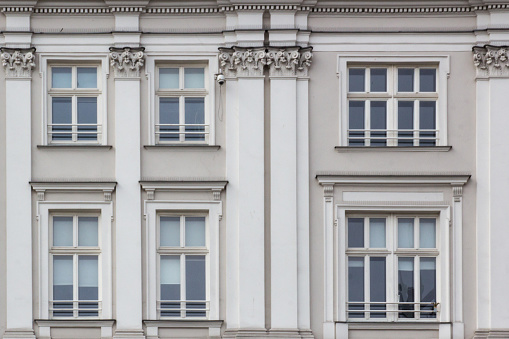 Six Windows on the facade of the white vintage house