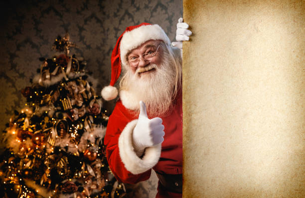 istock Santa Claus pointing on blank banner 874833190