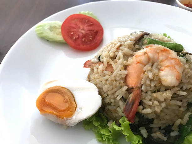istock Thai style food, fried rice with chili paste and shrimp and salted egg 874836354
