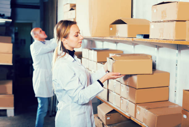 istock Couple transporting cart cardboard cases 874840630