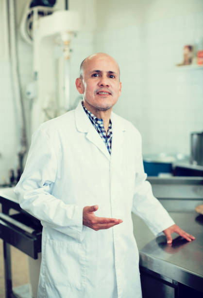 istock Man working in modern food factory 874840888
