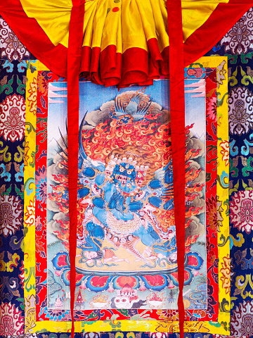 Gangtok, India - December 27, 2011: Buddhist thangka - a Tibetan Buddhist painting on cotton, or silk applique - in a monastery in Gangtok, Sikkim, India
