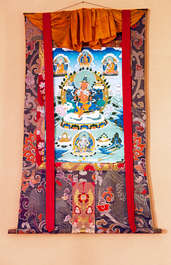 Gangtok, India - December 27, 2011: Buddhist thangka - a Tibetan Buddhist painting on cotton, or silk applique - in a monastery in Gangtok, Sikkim, India
