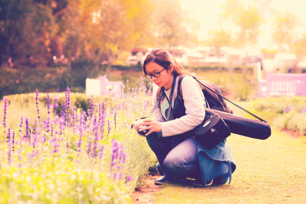 istock A woman looking to camera after taking photograph 874851722