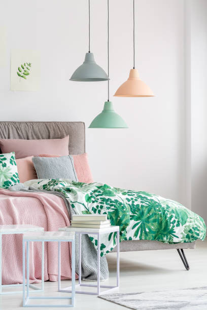 istock Pastel lamps above king-size bed 874851760