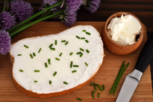Cheese spread and chives on slice of bread