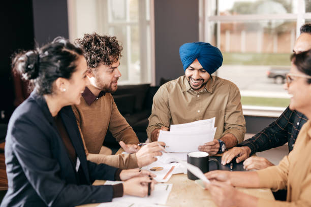 istock Laughing in the office after reviewing all numbers 874852124