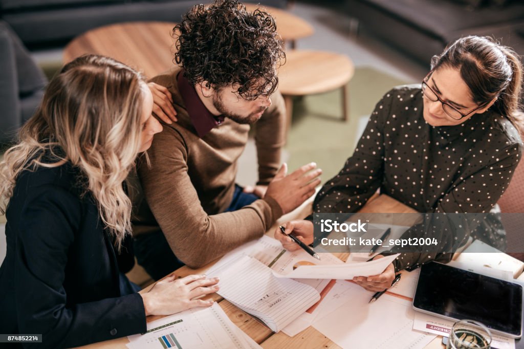 Better mortgage rates Multiracial group indoor Advice Stock Photo