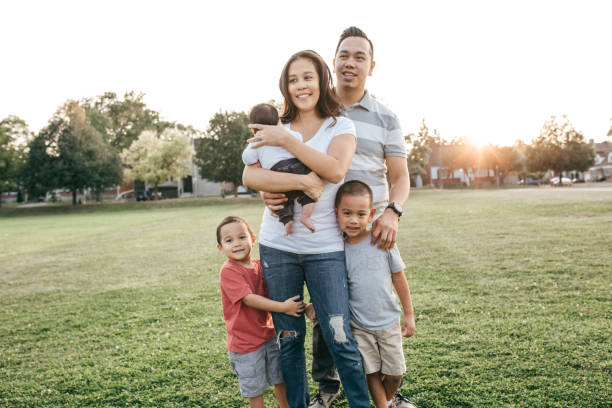 istock Family with three kids having fun 874852304