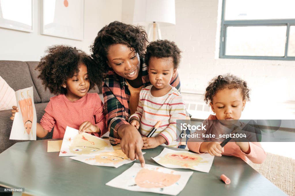 Group of kids playing and creating together Three People Stock Photo