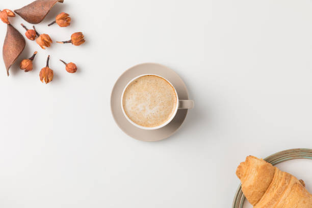 coffee with flowers and croisssant
