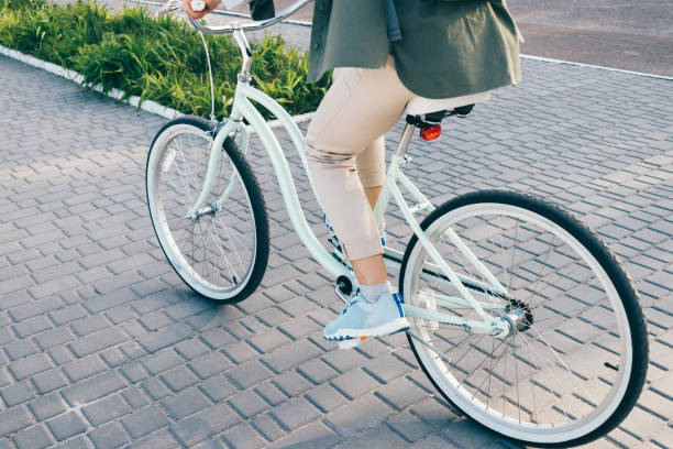 istock Woman riding a bicycle in the summer 874859990