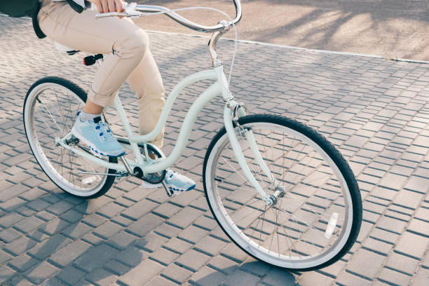 istock Cropped image of a woman riding a bicycle 874859994