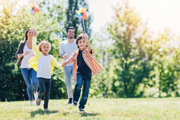 istock Young family playing in the park 874863568