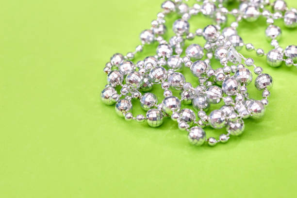 istock Shiny hair pins isolated on green background 874864004