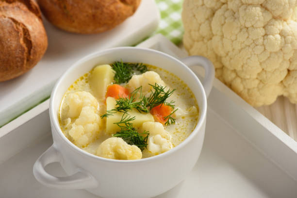 Healthy soup with cauliflower, carrot and potatoes. stock photo