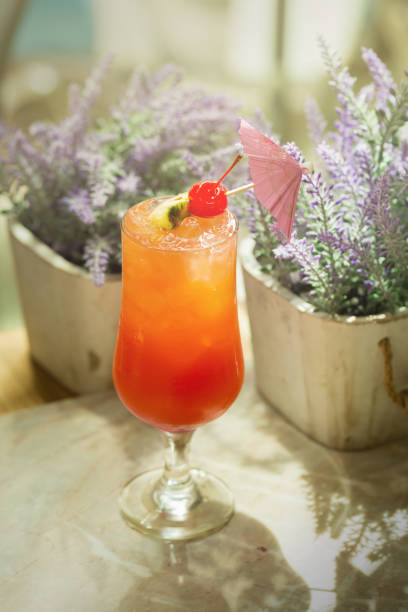 istock Glass of Passion fruit, pineapple, and pomegranate Cocktail 874867274